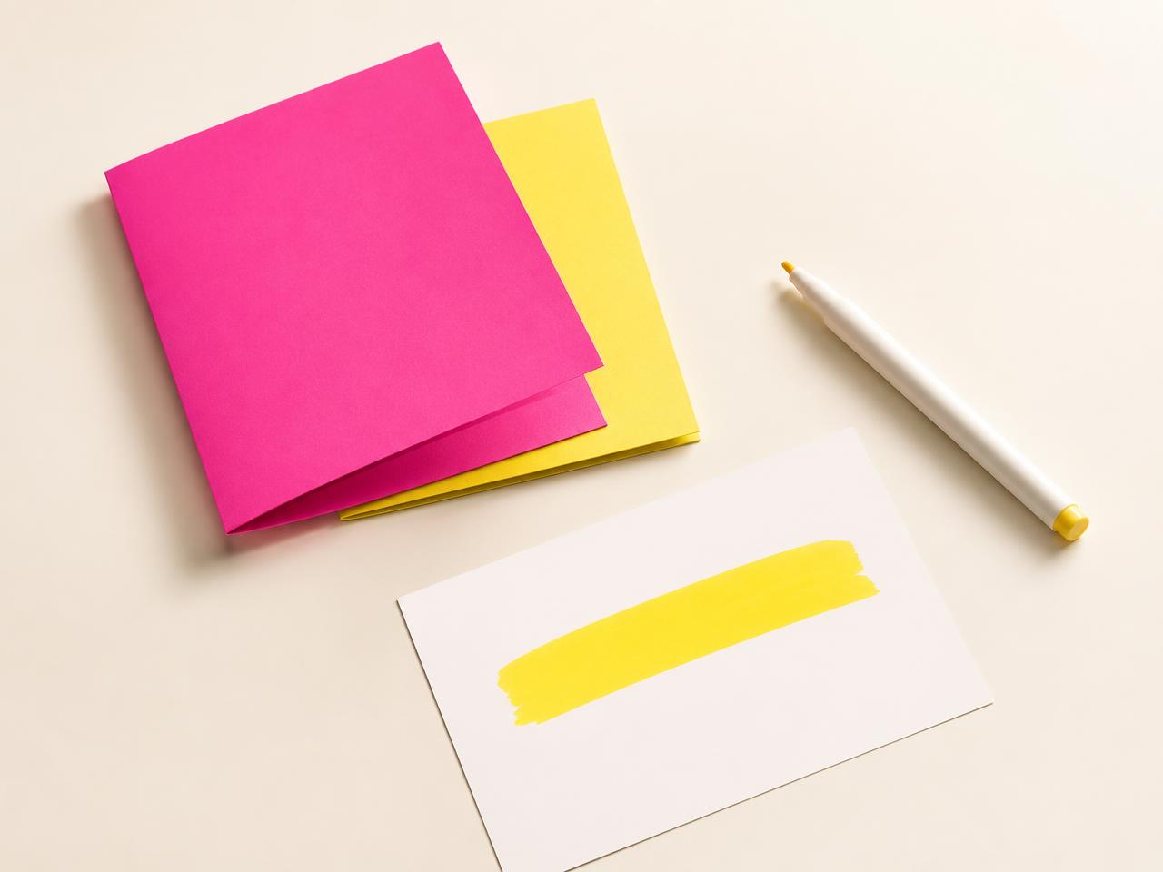 Pink and yellow brand cards next to a note page with a yellow highlighter mark
